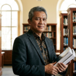 A professional academic editor evaluating a manuscript during the academic publishing peer review process.